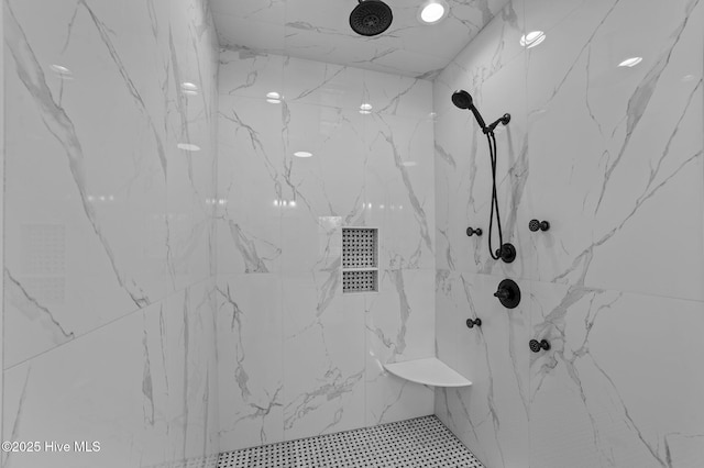 full bath with a marble finish shower