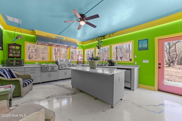 kitchen with visible vents, dishwasher, a center island, under cabinet range hood, and black microwave