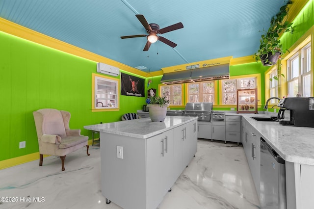 kitchen featuring a wall unit AC, light countertops, stainless steel dishwasher, under cabinet range hood, and a sink