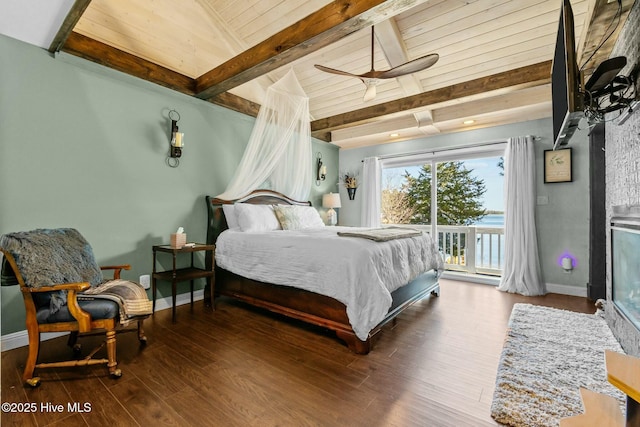 bedroom with access to exterior, beamed ceiling, baseboards, and wood finished floors