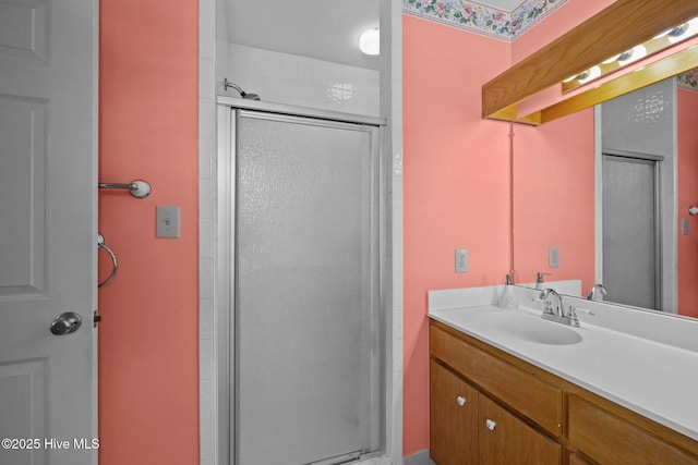 full bathroom featuring a stall shower and vanity