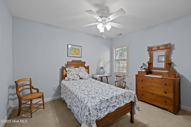 bedroom with light carpet, baseboards, visible vents, and ceiling fan