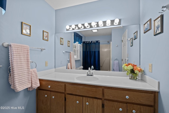 bathroom with a shower with curtain and vanity