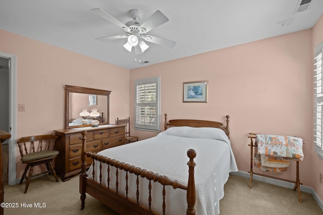 bedroom featuring light colored carpet, visible vents, ceiling fan, and baseboards