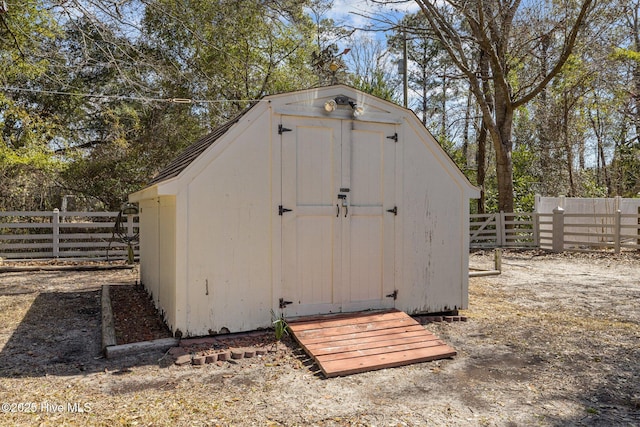 view of shed with a fenced backyard