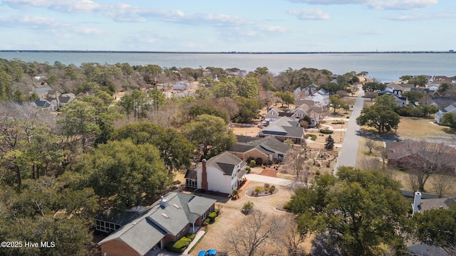 bird's eye view featuring a residential view and a water view