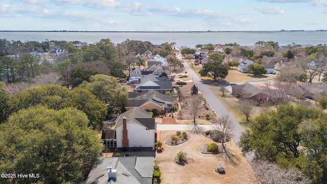 bird's eye view with a water view and a residential view