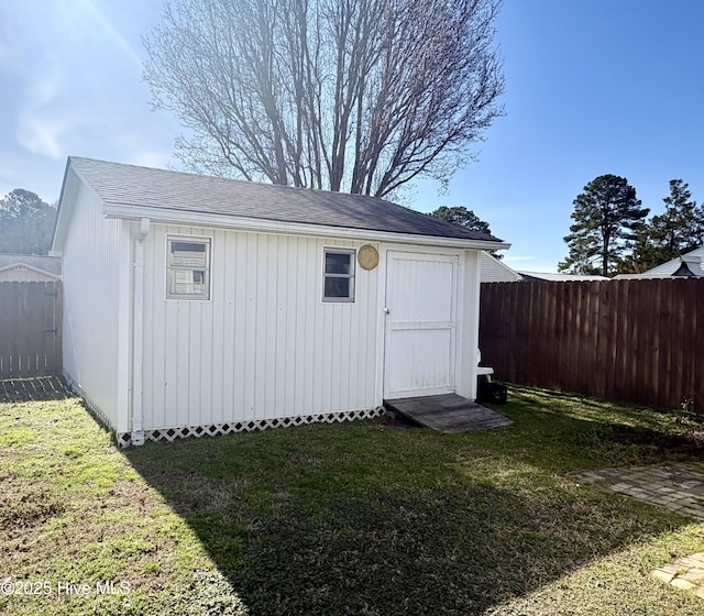 view of shed with a fenced backyard