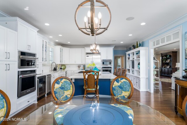 dining space with a notable chandelier and crown molding