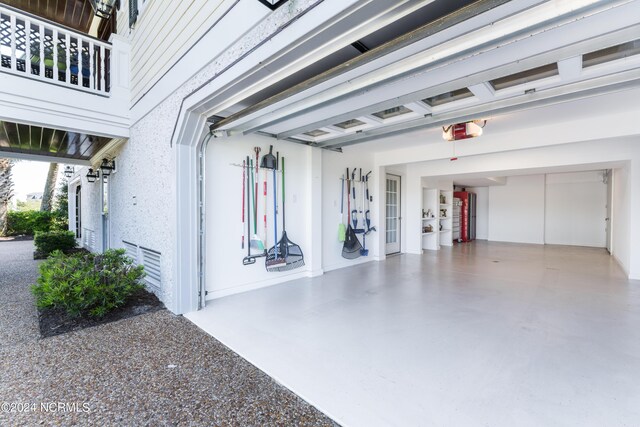 garage featuring baseboards and a garage door opener