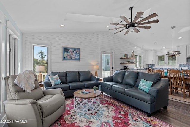 living room with recessed lighting, a ceiling fan, dark wood-style flooring, and vaulted ceiling