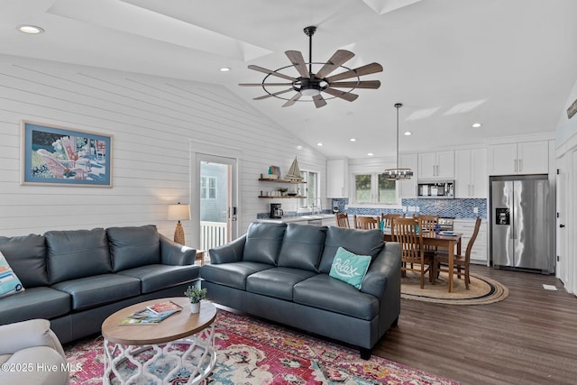 living room with dark wood finished floors, recessed lighting, a ceiling fan, and lofted ceiling