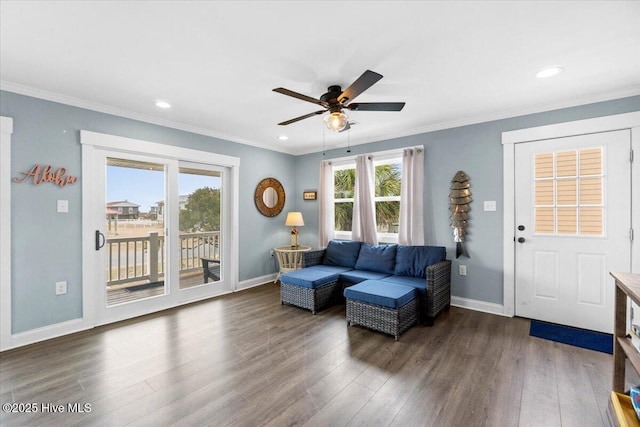 220 W Dolphin Dr, Oak Island, NC 28465 - living room with a ceiling fan, wood finished floors, baseboards, ornamental molding, and recessed lighting