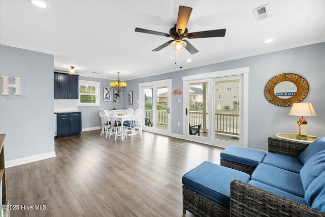 220 W Dolphin Dr, Oak Island, NC 28465 - living room with crown molding, baseboards, a chandelier, ceiling fan, and recessed lighting