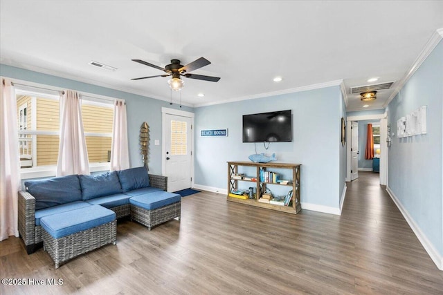 220 W Dolphin Dr, Oak Island, NC 28465 - living room featuring crown molding, ceiling fan, baseboards, wood finished floors, and recessed lighting