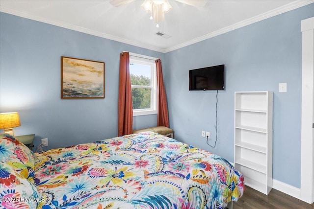 220 W Dolphin Dr, Oak Island, NC 28465 - bedroom featuring dark wood-style flooring, baseboards, ornamental molding, and ceiling fan