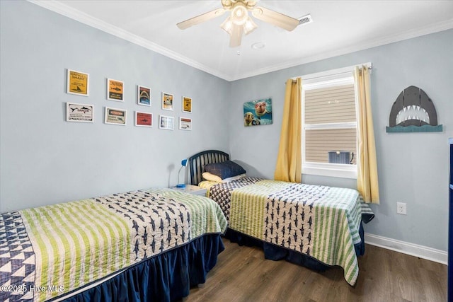 220 W Dolphin Dr, Oak Island, NC 28465 - bedroom with wood finished floors, crown molding, a ceiling fan, and baseboards