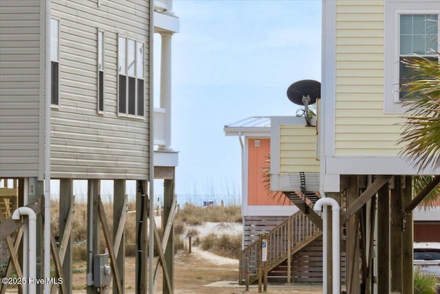 220 W Dolphin Dr, Oak Island, NC 28465 - view of side of home with stairs