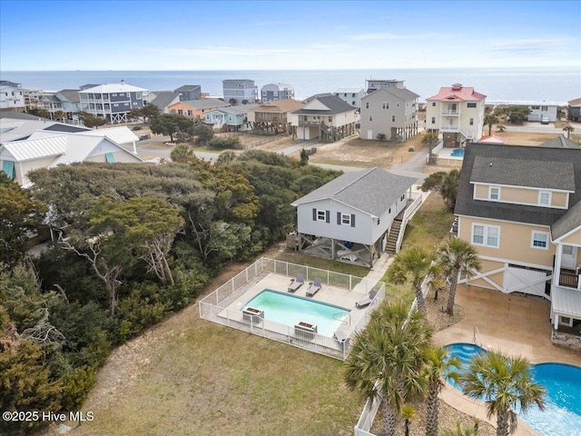 220 W Dolphin Dr, Oak Island, NC 28465 - drone / aerial view of a pool area and a nearby body of water