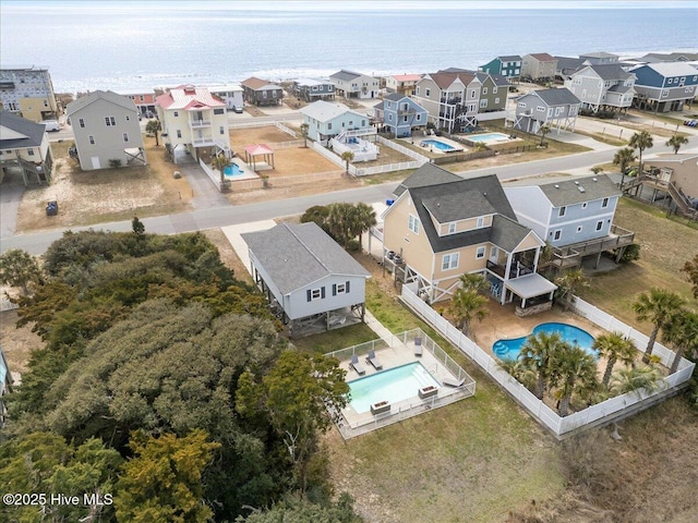 220 W Dolphin Dr, Oak Island, NC 28465 - aerial view of residential area featuring a pool and a large body of water