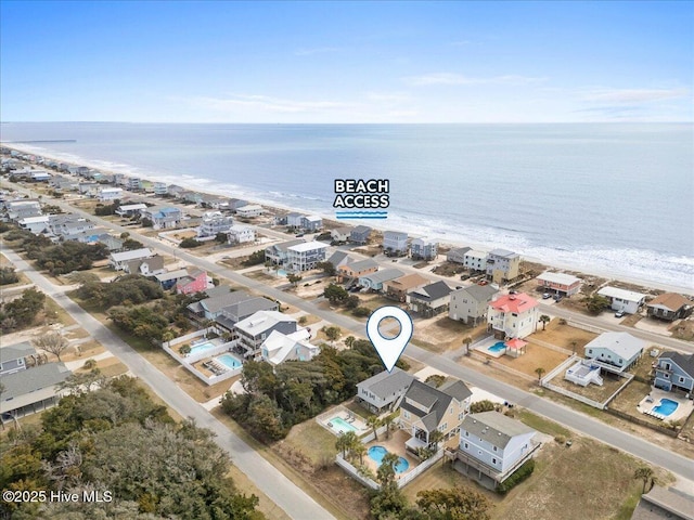 220 W Dolphin Dr, Oak Island, NC 28465 - bird's eye view of waterfront with a beach