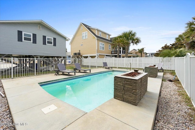 220 W Dolphin Dr, Oak Island, NC 28465 - view of swimming pool with a fenced backyard and a patio area
