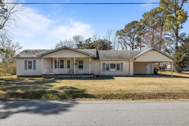 ranch-style home featuring driveway, covered porch, a front lawn, and a carport