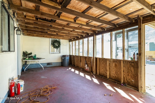 unfurnished sunroom featuring a wealth of natural light