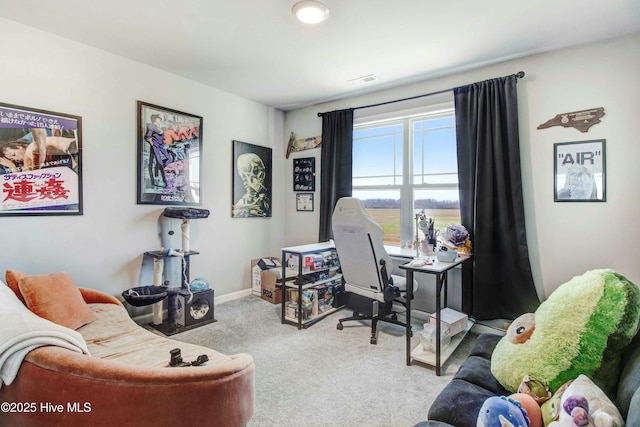 office featuring carpet floors, visible vents, and baseboards