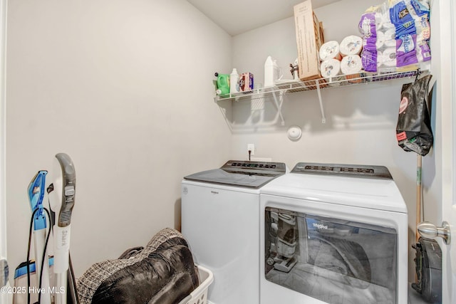 clothes washing area with laundry area and washer and dryer