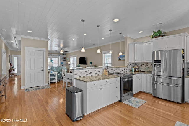 kitchen featuring a peninsula, stainless steel appliances, open floor plan, white cabinetry, and tasteful backsplash