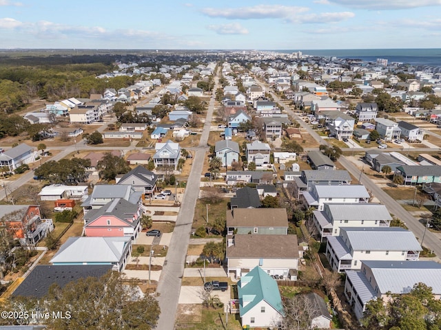 birds eye view of property featuring a residential view and a water view