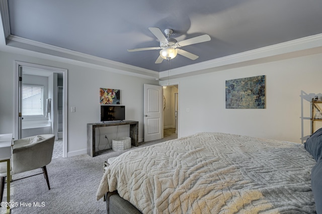 carpeted bedroom featuring a tray ceiling, ornamental molding, a ceiling fan, and baseboards