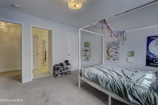 carpeted bedroom featuring connected bathroom