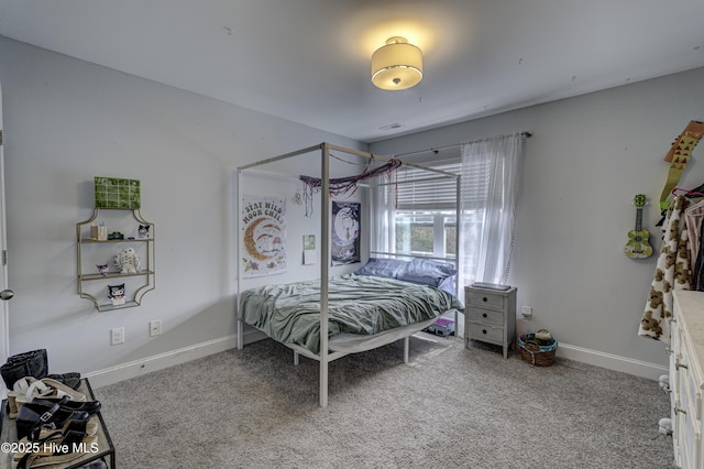 bedroom featuring carpet, visible vents, and baseboards