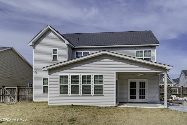 back of property featuring a ceiling fan, a patio area, french doors, and a fenced backyard