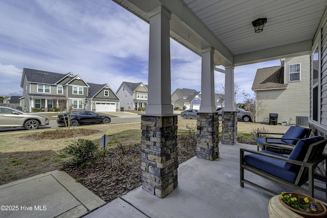 view of patio / terrace with a porch and a residential view