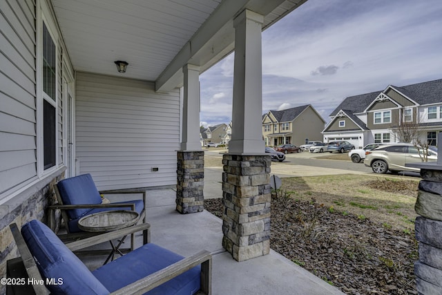 view of patio with a residential view and covered porch