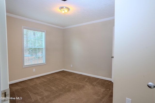 carpeted empty room with baseboards and crown molding