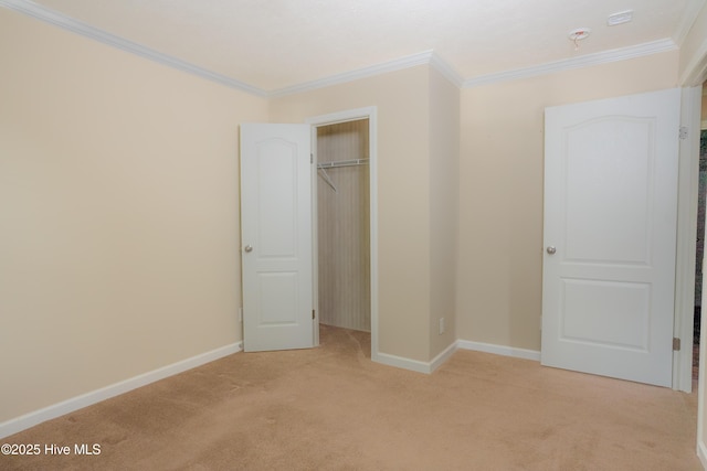 unfurnished bedroom with light carpet, baseboards, and ornamental molding