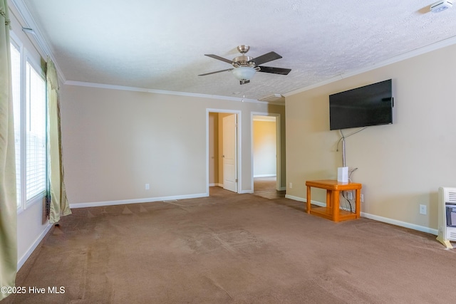 unfurnished living room featuring baseboards, carpet, and crown molding