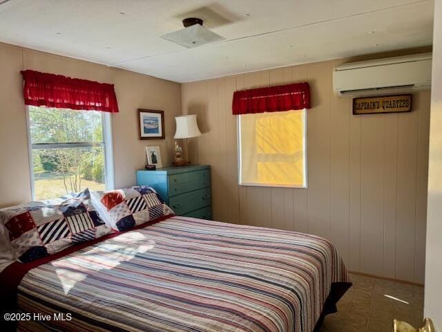 bedroom featuring a wall mounted AC