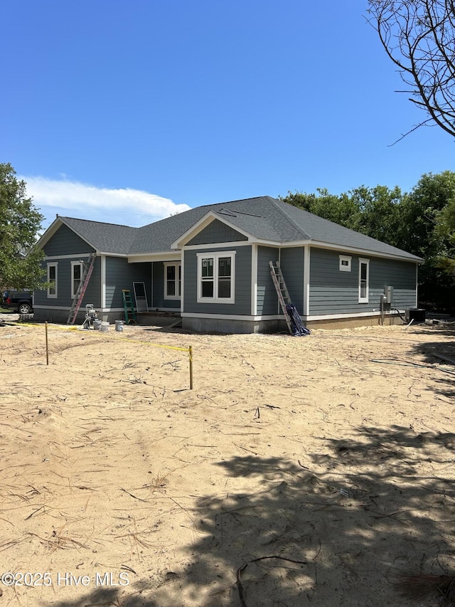 305 Pine Knoll Cir, Pine Knoll Shores, NC 28512 - rear view of property with a shingled roof