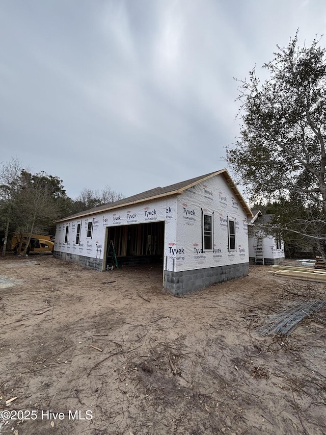 305 Pine Knoll Cir, Pine Knoll Shores, NC 28512 - view of property exterior with a garage