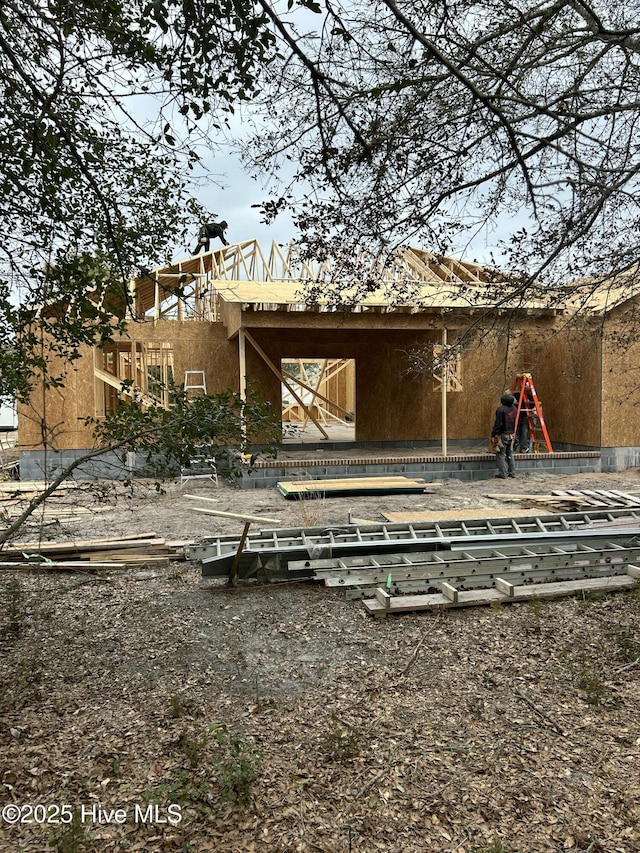 back of property featuring stucco siding