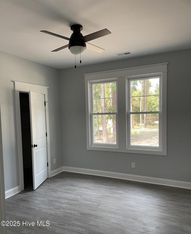 305 Pine Knoll Cir, Pine Knoll Shores, NC 28512 - spare room with wood finished floors, baseboards, and ceiling fan