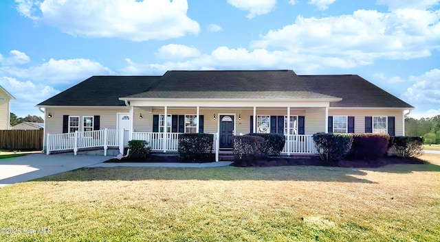 single story home featuring covered porch and a front yard