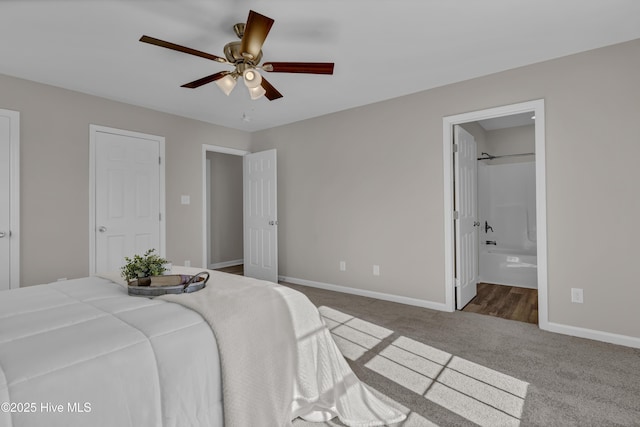 bedroom featuring ceiling fan, carpet, connected bathroom, and baseboards