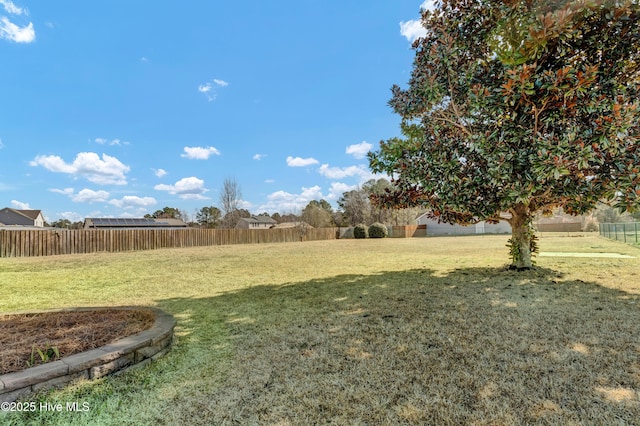 view of yard with fence