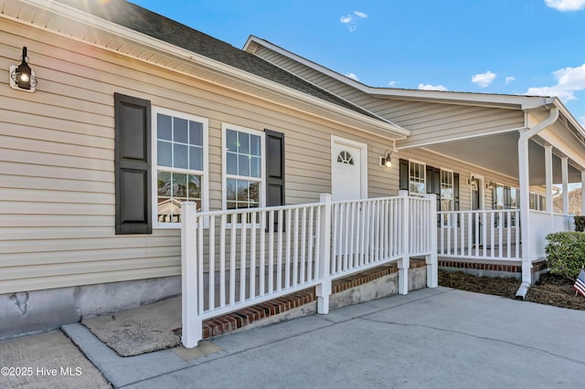 doorway to property featuring covered porch